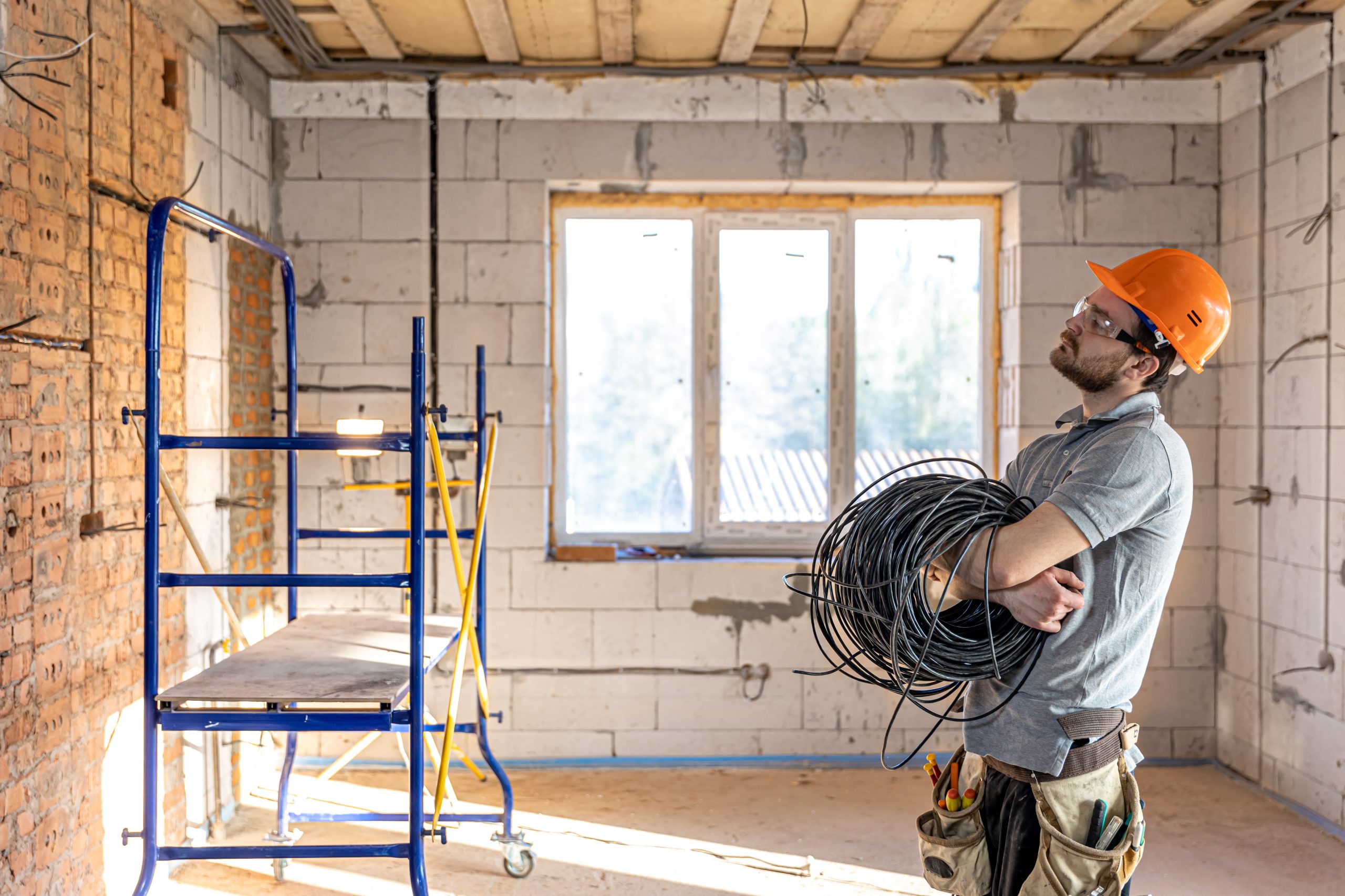 Electrician contractor handling electric cable installation